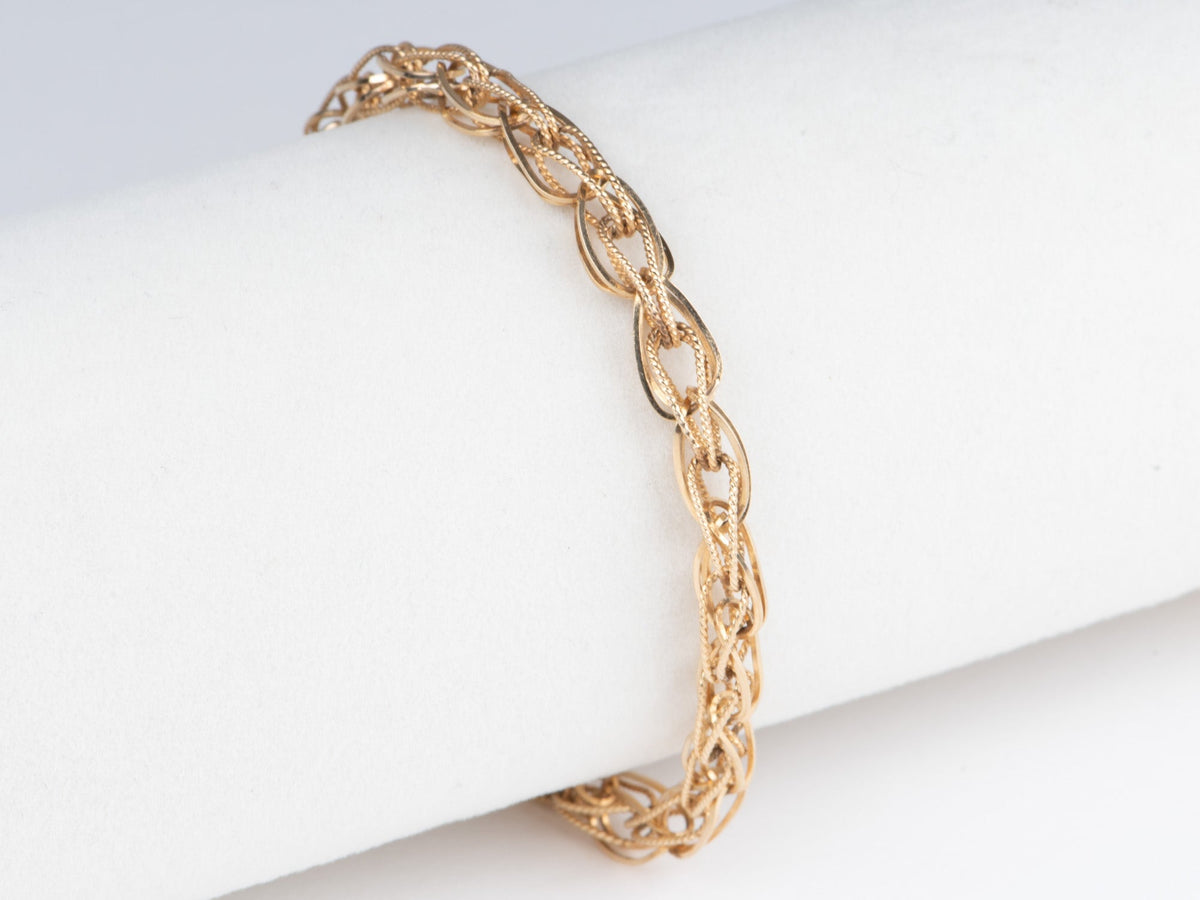 14K Gold Intertwined Braided Link Bracelet 6.68g R2066 Aurora Designer