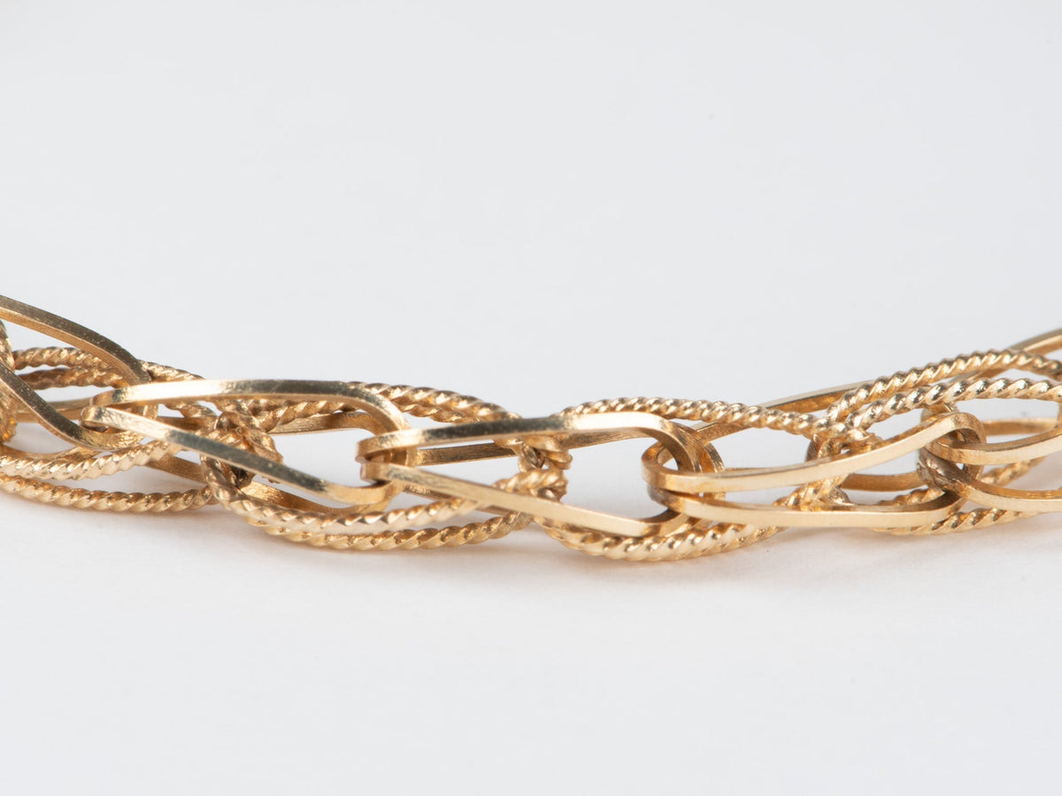 14K Gold Intertwined Braided Link Bracelet 6.68g R2066 Aurora Designer