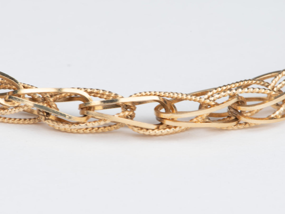 14K Gold Intertwined Braided Link Bracelet 6.68g R2066 Aurora Designer